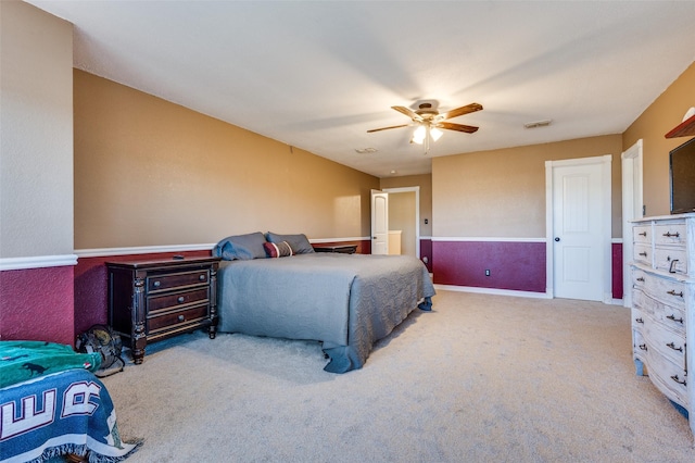 bedroom featuring visible vents, carpet floors, and ceiling fan