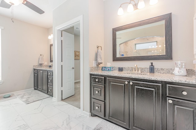 full bathroom with vanity, baseboards, marble finish floor, and a ceiling fan