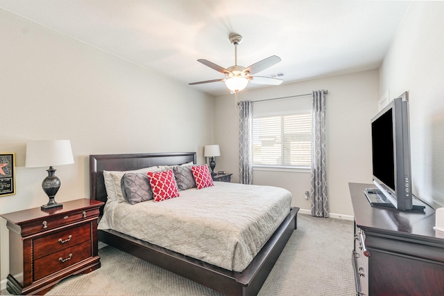 carpeted bedroom featuring visible vents, a ceiling fan, and baseboards