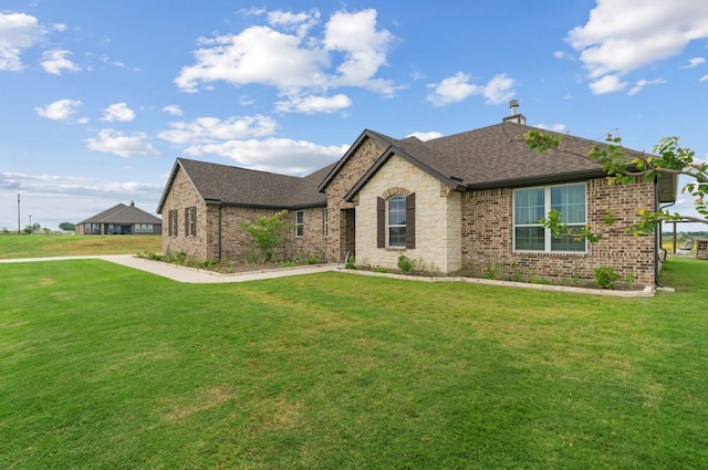 113 Misty Mountain Ln, Rhome, TX 76078 - french country home with brick siding, a front yard, roof with shingles, and a chimney