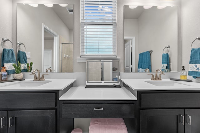 full bathroom with two vanities, visible vents, a stall shower, and a sink
