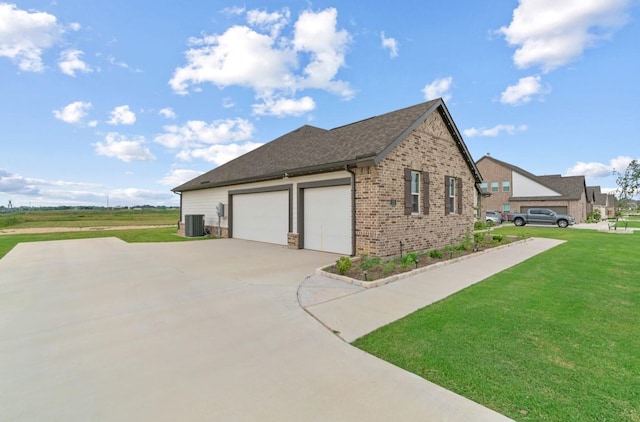 113 Misty Mountain Ln, Rhome, TX 76078 - view of home's exterior with cooling unit, brick siding, a lawn, a garage, and driveway