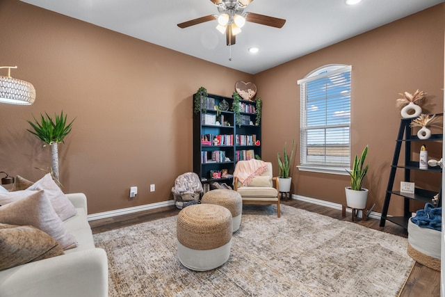 living area with recessed lighting, wood finished floors, baseboards, and ceiling fan