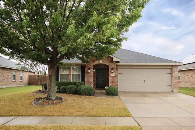 single story home featuring brick siding, concrete driveway, a garage, and roof with shingles