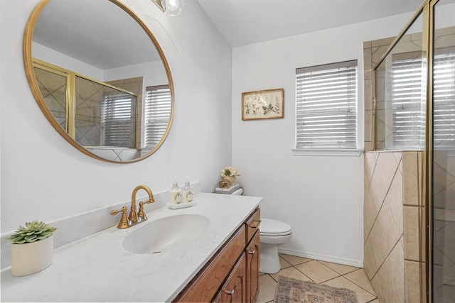 bathroom featuring vanity, a shower stall, toilet, and tile patterned flooring