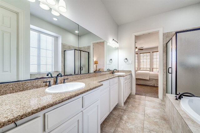 13508 Lampton Cir SE, Frisco, TX 75035 - ensuite bathroom featuring double vanity, a stall shower, a garden tub, and tile patterned floors