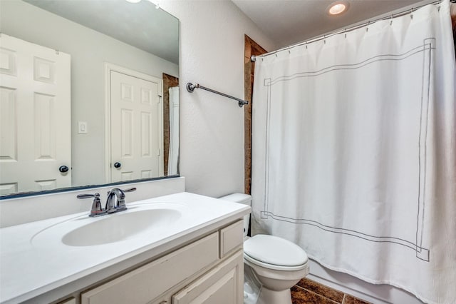 bathroom with toilet and vanity