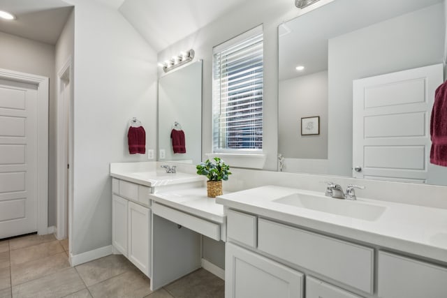 full bathroom featuring double vanity, recessed lighting, tile patterned floors, and a sink