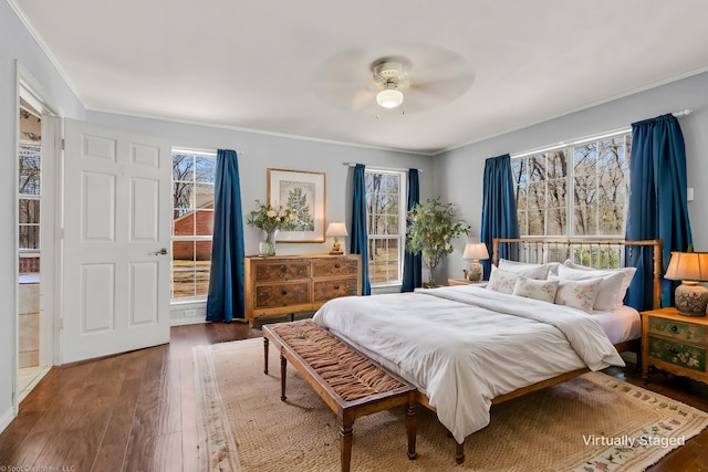 bedroom featuring ornamental molding, ceiling fan, and hardwood / wood-style floors