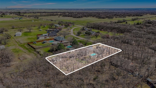 birds eye view of property featuring a rural view