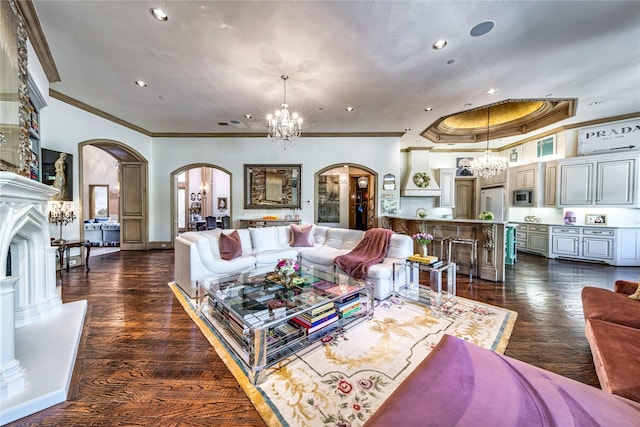 living room with recessed lighting, arched walkways, crown molding, a chandelier, and dark wood-style flooring