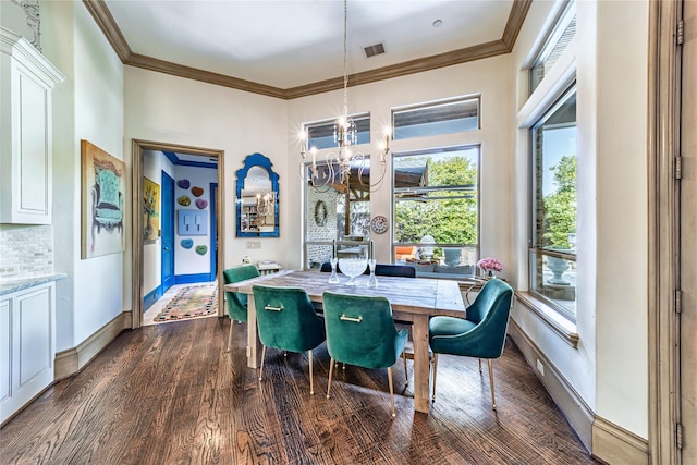 dining room featuring a chandelier, baseboards, ornamental molding, and dark wood-style flooring