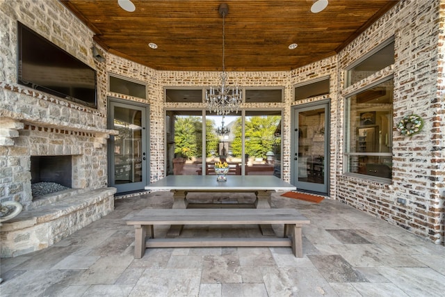 view of patio / terrace with an outdoor stone fireplace