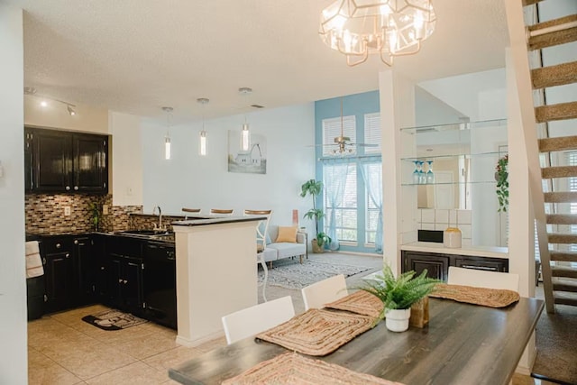 dining space featuring stairs, light tile patterned floors, ceiling fan with notable chandelier, and a textured ceiling