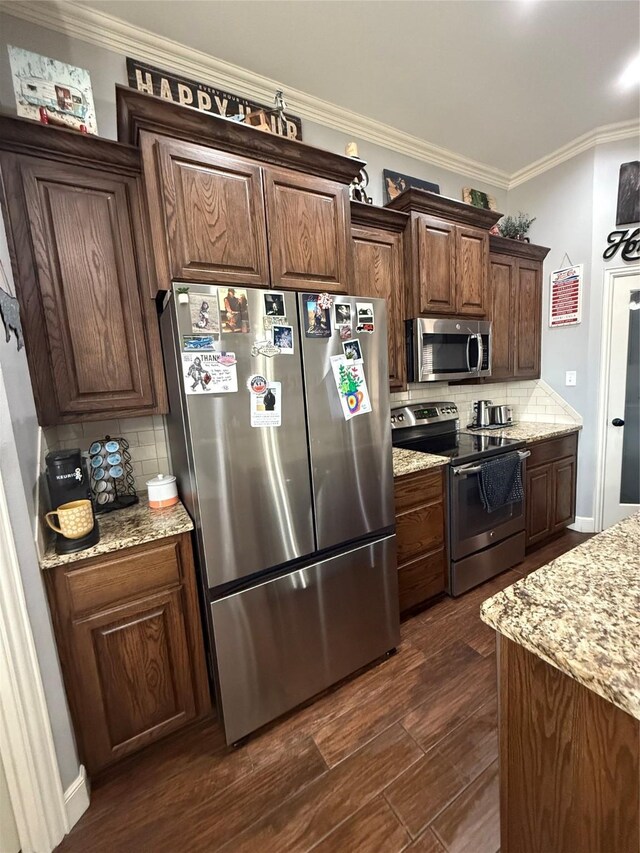 kitchen with stainless steel appliances, backsplash, ornamental molding, and dark wood-style flooring