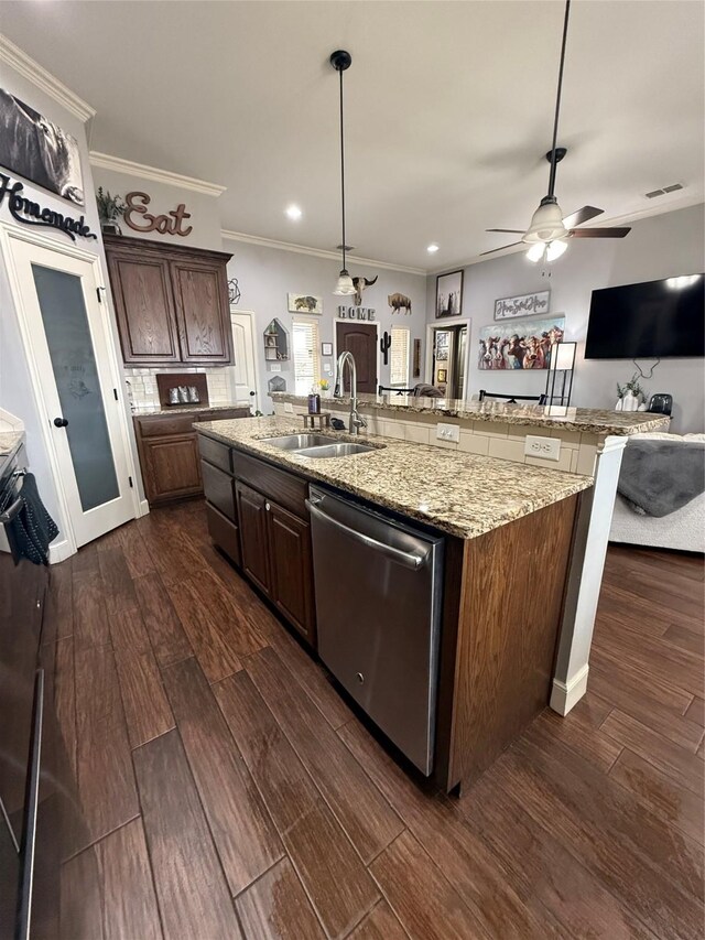 kitchen with dark wood-type flooring, crown molding, tasteful backsplash, and appliances with stainless steel finishes