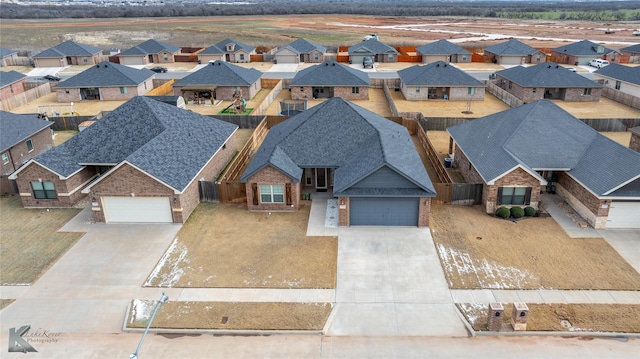 birds eye view of property with a residential view