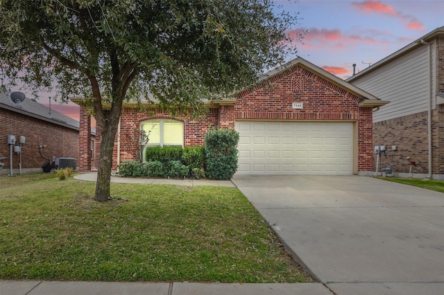 view of front of home featuring brick siding, an attached garage, a front yard, central AC unit, and driveway