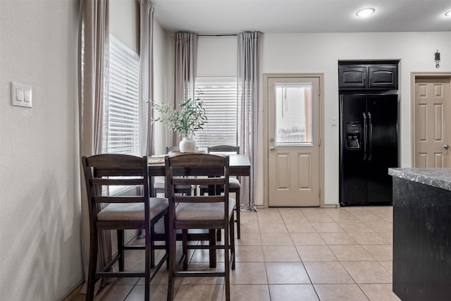 dining area with light tile patterned floors