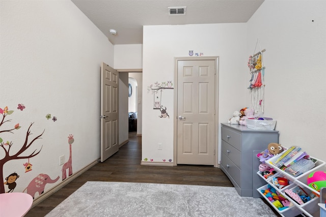 playroom featuring visible vents and wood finished floors