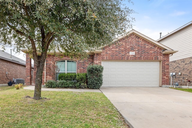 ranch-style home with concrete driveway, a front yard, a garage, brick siding, and central AC unit