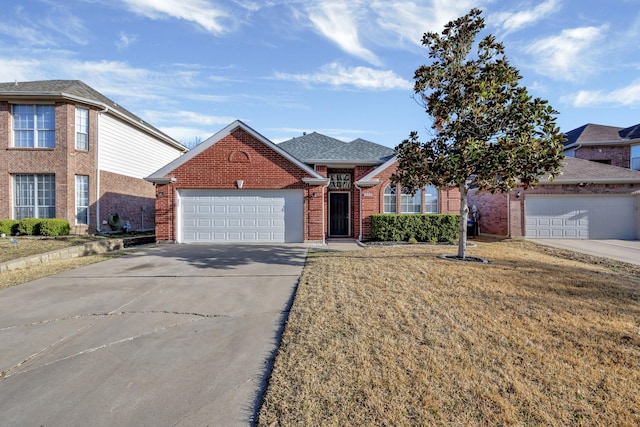 view of front of property with brick siding, driveway, an attached garage, and a shingled roof