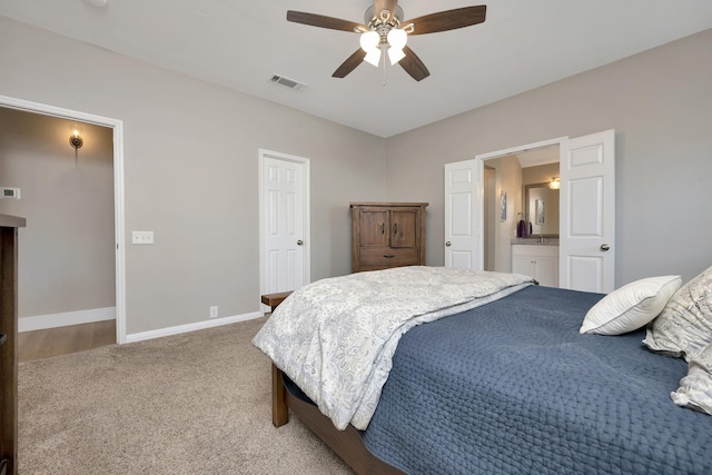 carpeted bedroom featuring baseboards, visible vents, and ceiling fan