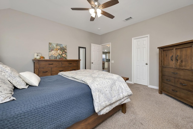 bedroom featuring ceiling fan, light colored carpet, visible vents, and baseboards