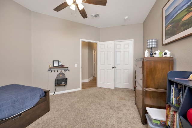 bedroom with visible vents, baseboards, a ceiling fan, and carpet flooring