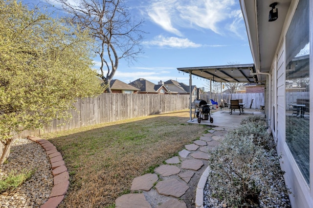 view of yard featuring a patio and a fenced backyard