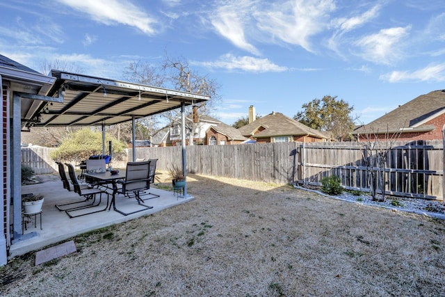 view of yard with a patio area and a fenced backyard