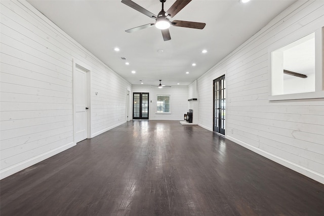 unfurnished living room featuring visible vents, baseboards, recessed lighting, wood finished floors, and a ceiling fan