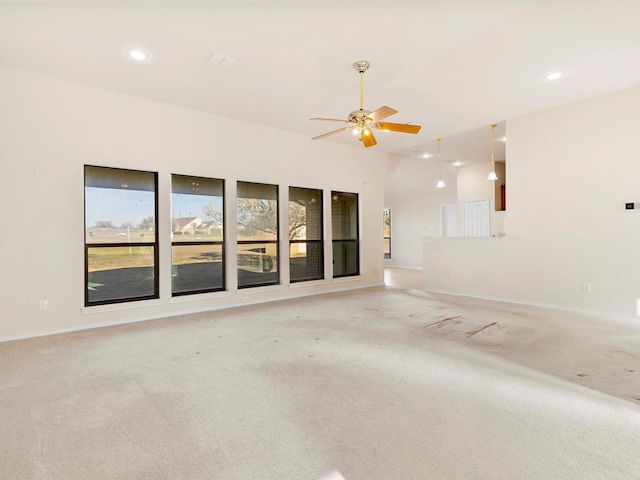 empty room with ceiling fan, recessed lighting, baseboards, and light carpet