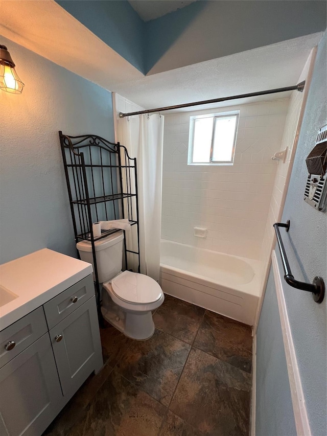 bathroom featuring toilet, vanity, and shower / bath combo