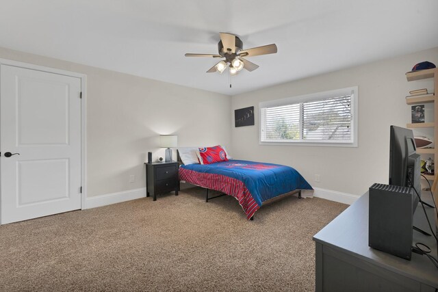 bedroom featuring baseboards, carpet, and a ceiling fan