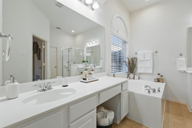 bathroom featuring a shower stall, a bath, visible vents, and tile patterned floors