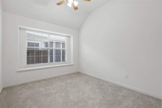 unfurnished room featuring carpet flooring, ceiling fan, baseboards, and lofted ceiling