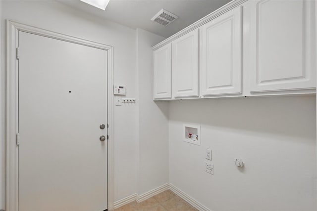 clothes washing area with visible vents, cabinet space, hookup for a washing machine, and baseboards