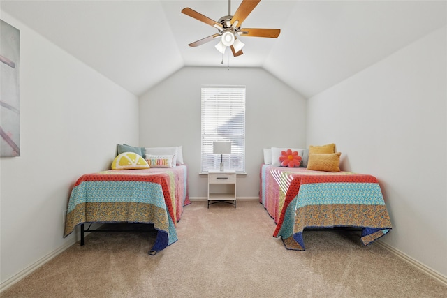 carpeted bedroom with baseboards, lofted ceiling, and a ceiling fan