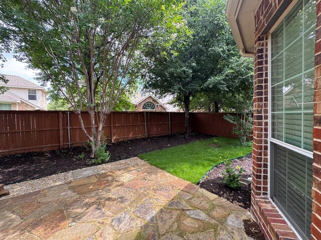 1161 Mission Ln, Lantana, TX 76226 - fenced backyard featuring a patio area