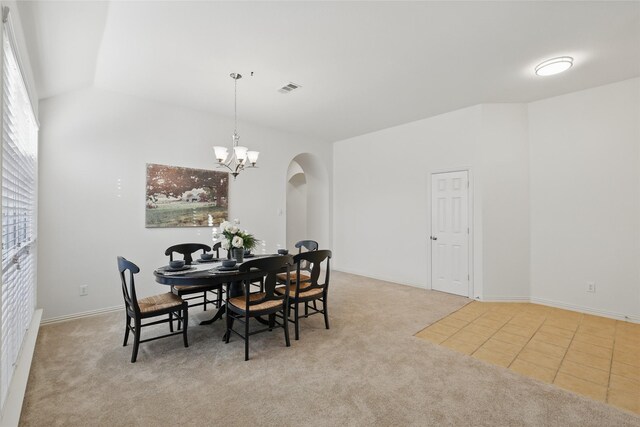 1161 Mission Ln, Lantana, TX 76226 - dining area with arched walkways, carpet, a chandelier, and vaulted ceiling