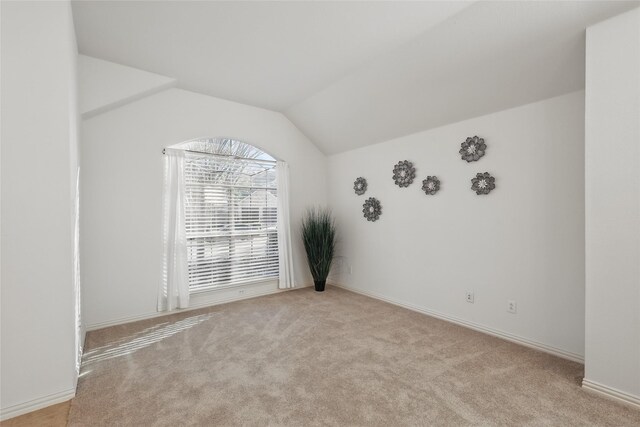 1161 Mission Ln, Lantana, TX 76226 - carpeted spare room featuring vaulted ceiling and baseboards