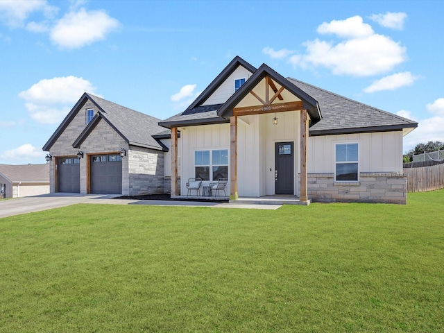 modern inspired farmhouse with stone siding, a garage, board and batten siding, and a front yard