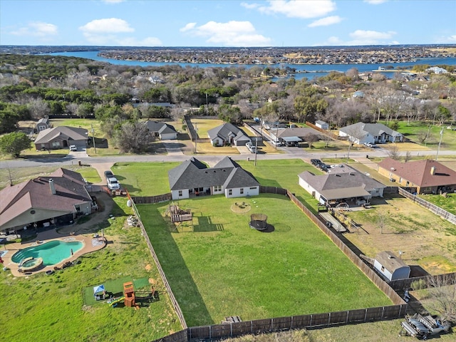 bird's eye view with a water view and a residential view