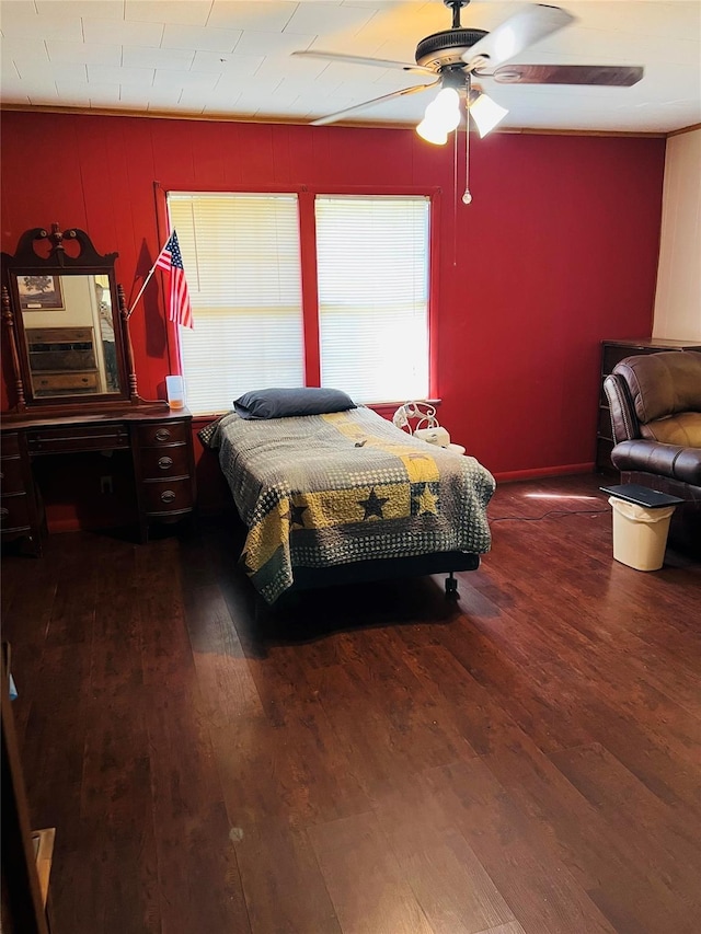 bedroom featuring a ceiling fan and wood finished floors