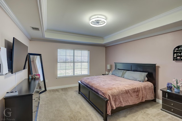 bedroom with light colored carpet, crown molding, a raised ceiling, and baseboards