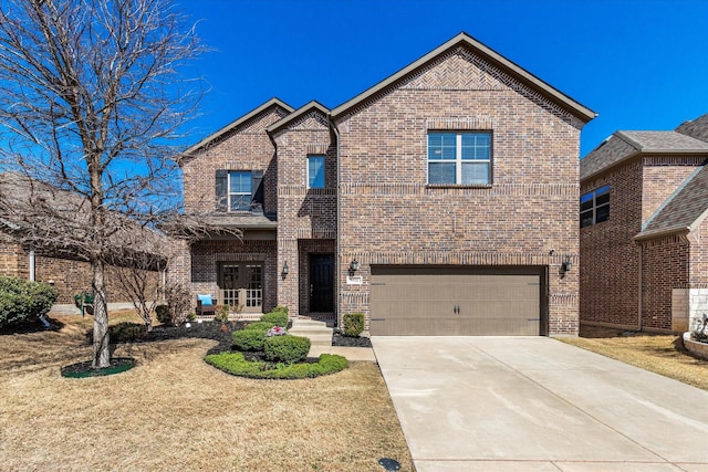 traditional home with brick siding, concrete driveway, and a garage