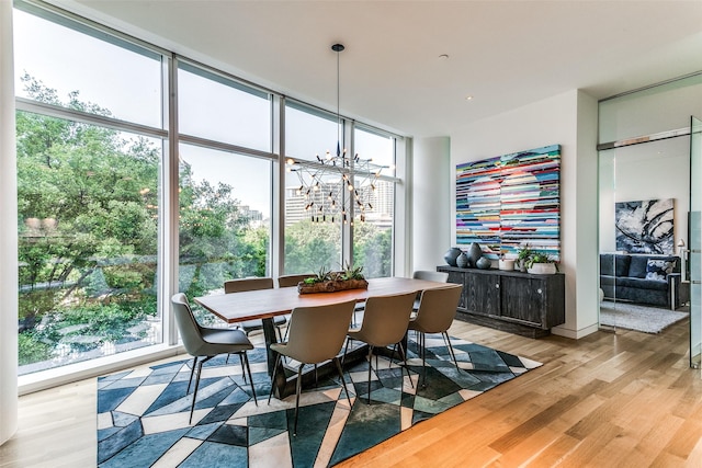 dining room featuring a notable chandelier and light wood finished floors