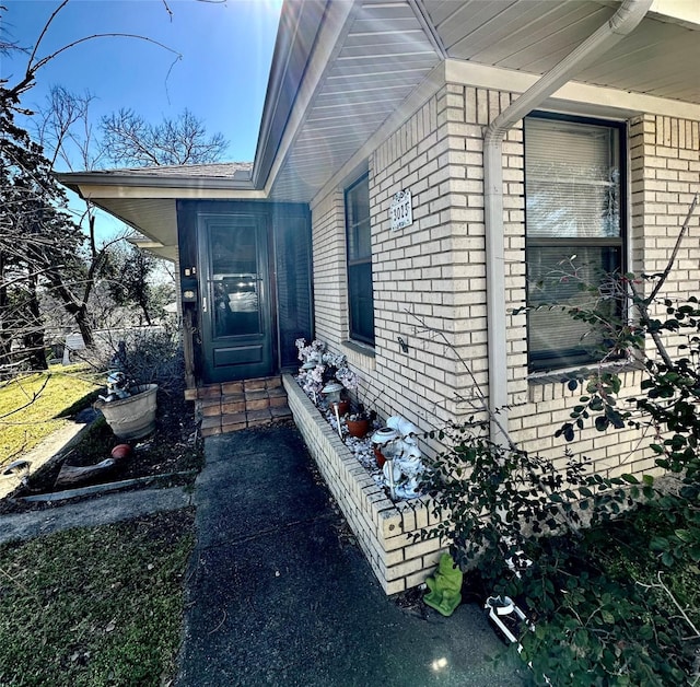 view of home's exterior featuring brick siding