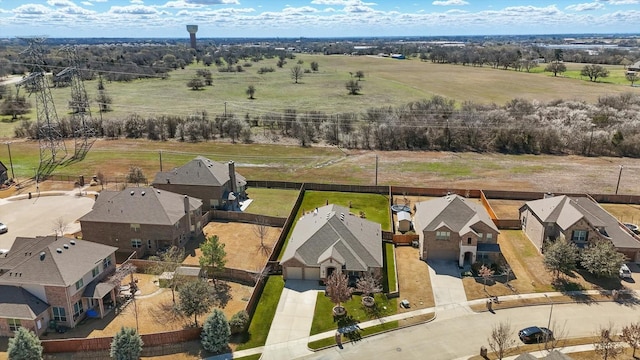 birds eye view of property featuring a residential view and a rural view